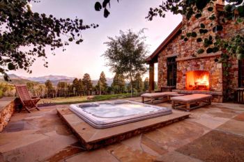 Telluride, Colorado pation exterior with hot tub and fireplace