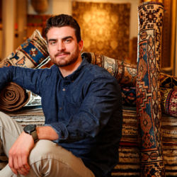 Gallery Manager Chris Jaeger at Azadi Fine Rugs in Telluride, Colorado. azadi fine rugs