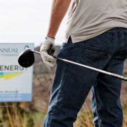 Colorado Oil and Gas Association's annual golf tournament. man carrying golf club