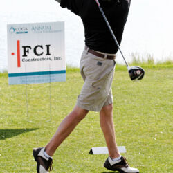 golfer teeing off