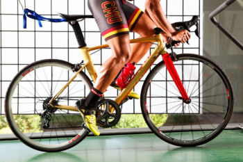 Colorado Mesa University Athletics man pedaling a bicycle