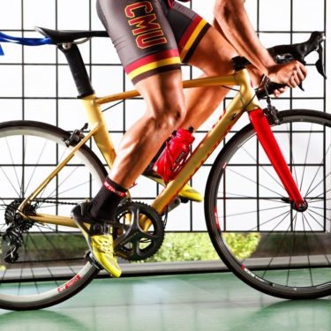 Colorado Mesa University Athletics man pedaling a bicycle