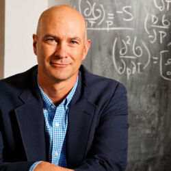 man with mathematical equations