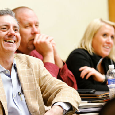 Western Healthcare Alliance annual summit. people laugh in a meeting