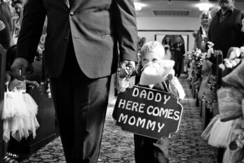 Ring barer walks in front of mother