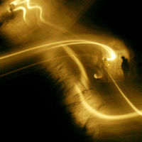 The miners’ headlamps create the only illumination for Ron Head, left, and Chad Reed to see by as they drill holes for blasting.